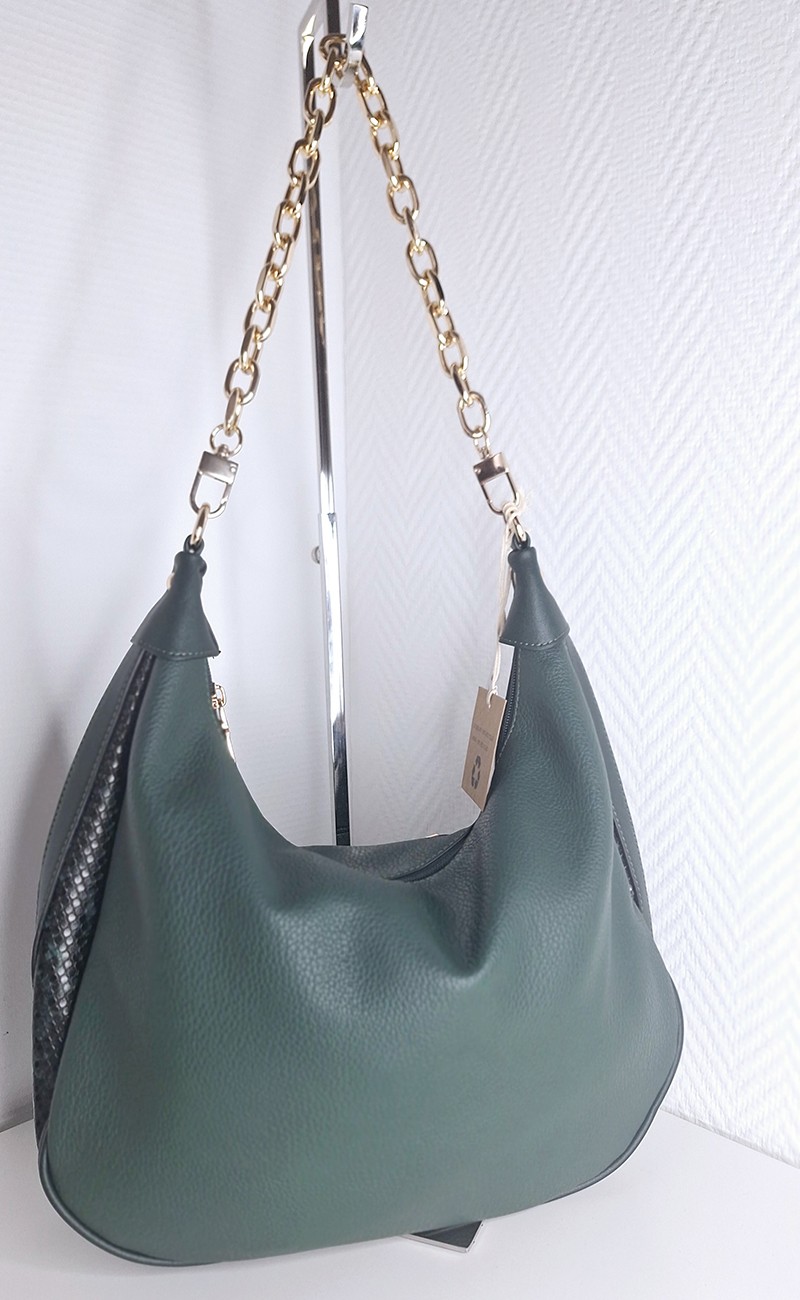 Green handbag with gold shoulder strap