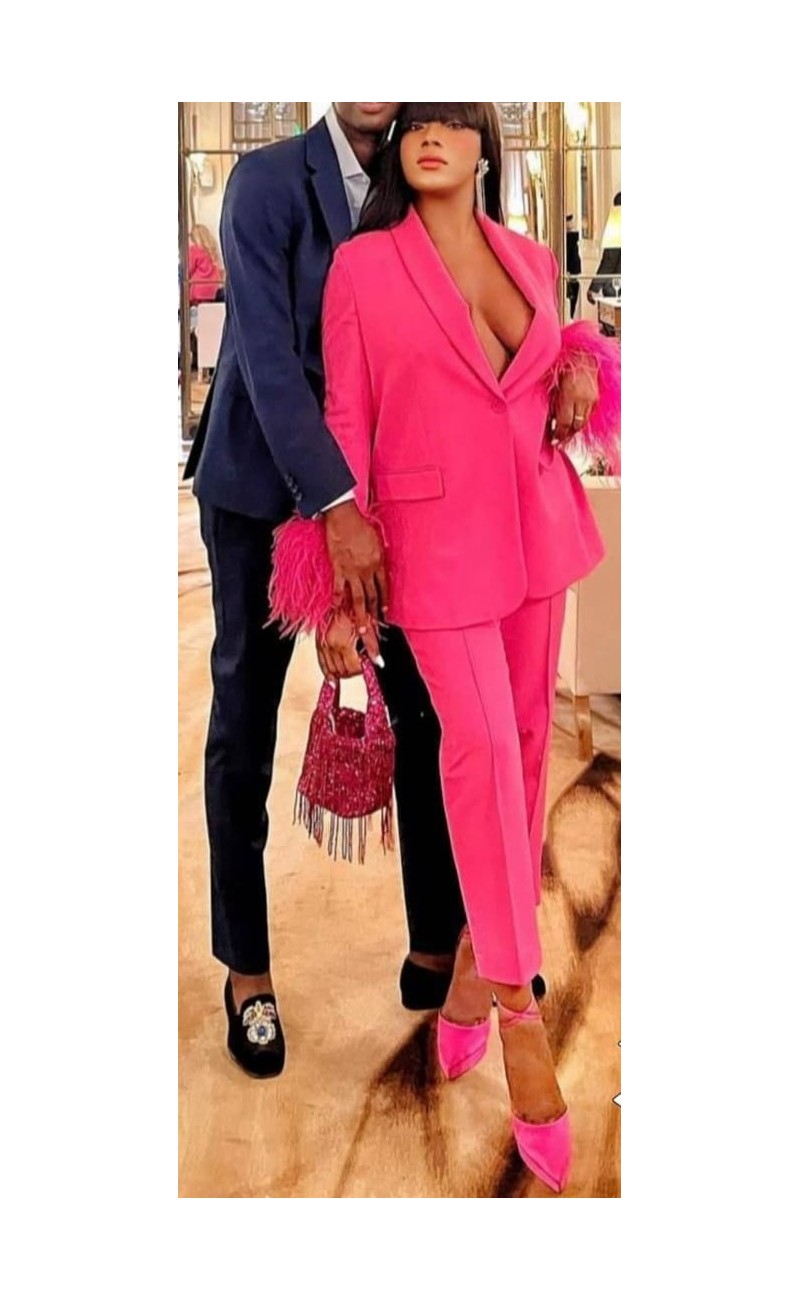 pink set trousers/jacket with feathers on the sleeves